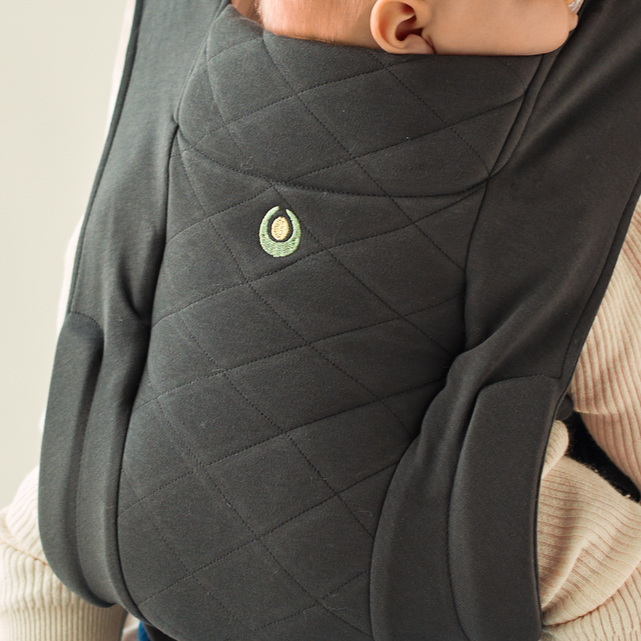 This image is a close up of the super soft organic cotton fabric quilted front part of the carrier.