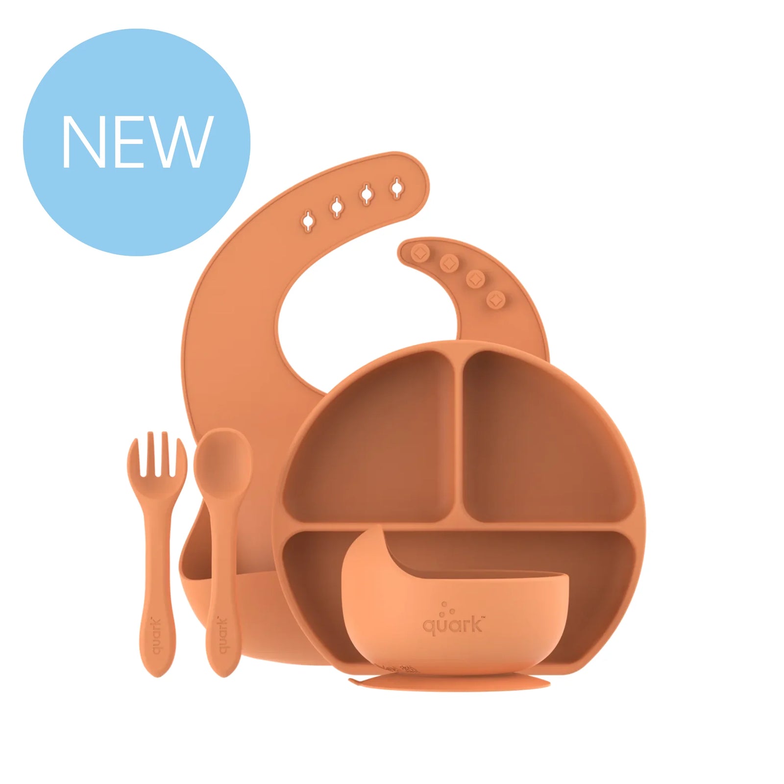 eedi by Quark silicone baby feeding set in terracotta orange, includes suction plate, bowl, bib, spoon, and fork, BPA-free toddler dinnerware for weaning and self-feeding.