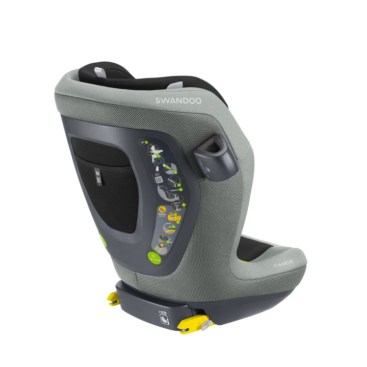 Angled view of Swandoo Charlie i-Size child booster seat in Groovy Green featuring ergonomic design and ISOFIX installation.