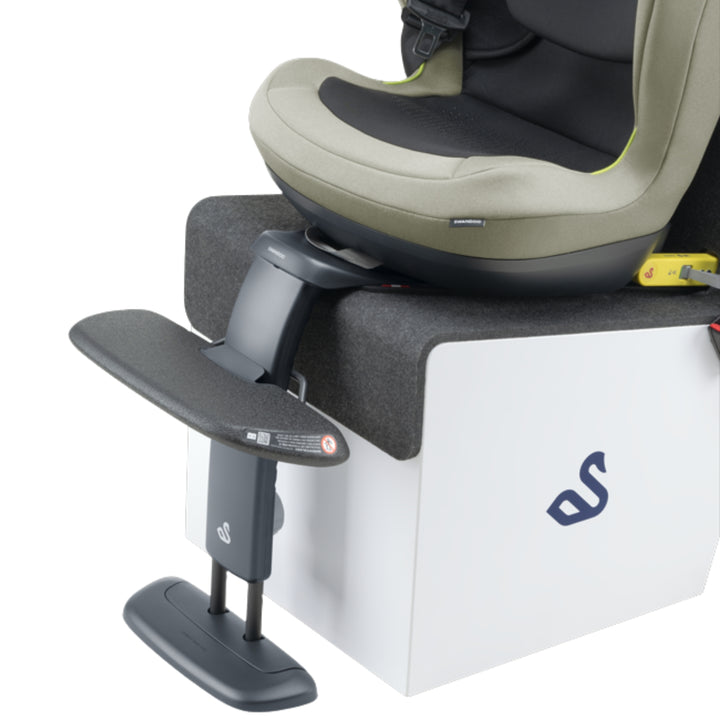 Swandoo universal footrest accessory attached to a child car seat on white background