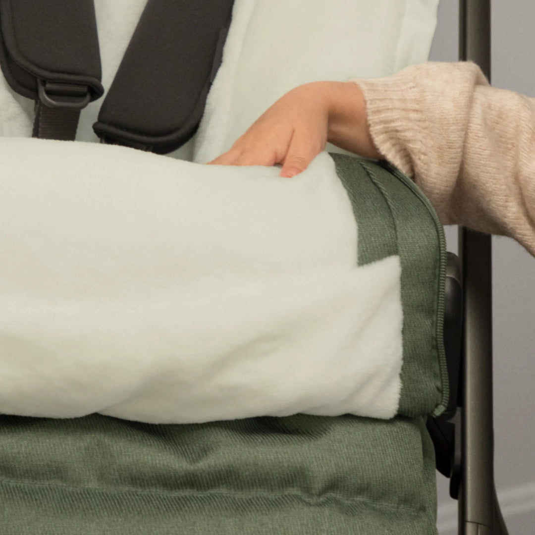 Close-up of the UPPAbaby 2-in-1 Seasonal Cozy Ganoosh showing the plush fleece lining and zip-out liner detail, designed to keep toddlers warm and comfortable in cold weather stroller walks.