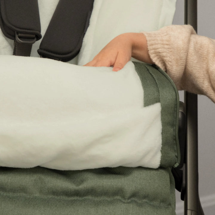 Close-up of the UPPAbaby 2-in-1 Seasonal Cozy Ganoosh showing the plush fleece lining and zip-out liner detail, designed to keep toddlers warm and comfortable in cold weather stroller walks.