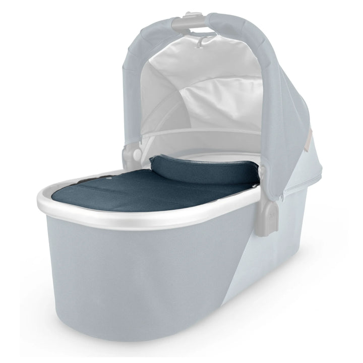 UPPAbaby Bassinet V2 with Finn blue boot cover on a white background