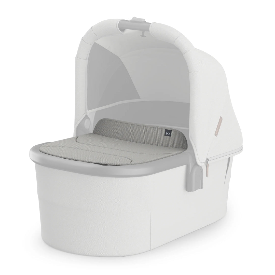 UPPAbaby Bassinet V3 in light grey with Savannah beige boot cover, shown on a white background