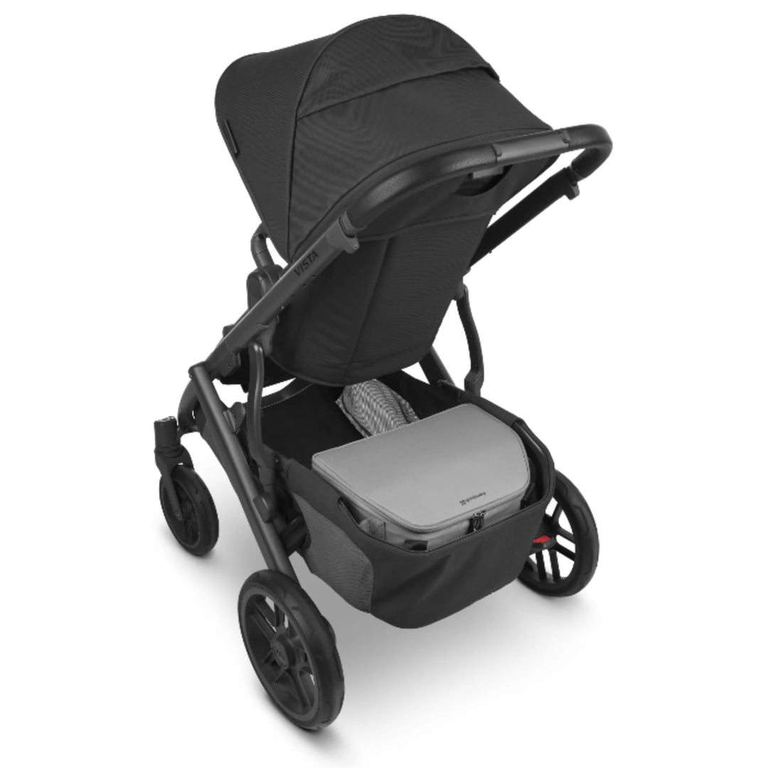 UPPAbaby Bevvy stroller basket cooler box installed in UPPAbaby pushchair basket, insulated cooler accessory for carrying food and drinks on family outings.