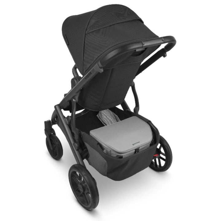 UPPAbaby Bevvy stroller basket cooler box installed in UPPAbaby pushchair basket, insulated cooler accessory for carrying food and drinks on family outings.