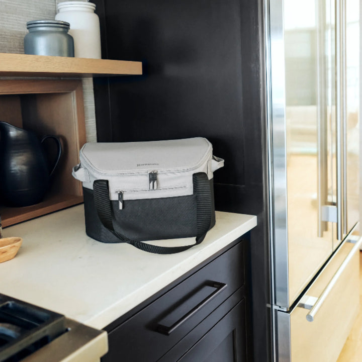 UPPAbaby Bevvy stroller basket cooler box used as an insulated lunch cooler in the kitchen, portable cooler bag for keeping food and drinks fresh on the go.