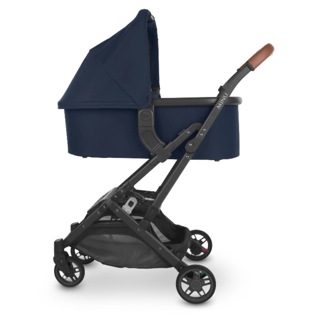UPPAbaby Carrycot V2 in Noa navy shown on UPPAbaby pushchair frame, newborn bassinet compatible with Vista and Cruz strollers.