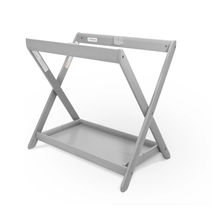 UPPAbaby Carrycot Stand in sleek grey finish, a secure foldable bassinet stand with sturdy cross-frame design and lower storage tray for use with UPPAbaby carrycots