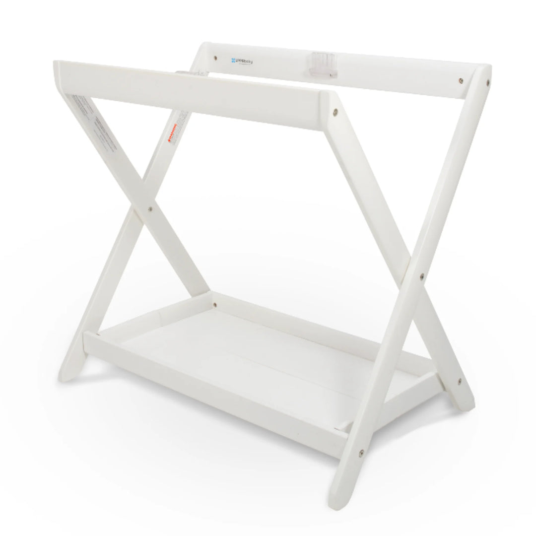 UPPAbaby Carrycot Stand in white finish, a sturdy foldable bassinet stand with cross-frame design and lower storage tray compatible with all UPPAbaby carrycots.