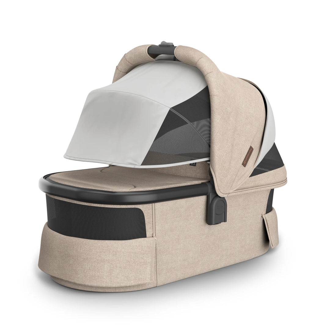 UPPAbaby Vista V3 carrycot in the Liam oatmeal colourway with sunshade lowered and ventilation panels open, showcasing the breathable mesh design, UPF canopy coverage, premium woven fabrics and newborn-ready bassinet construction.