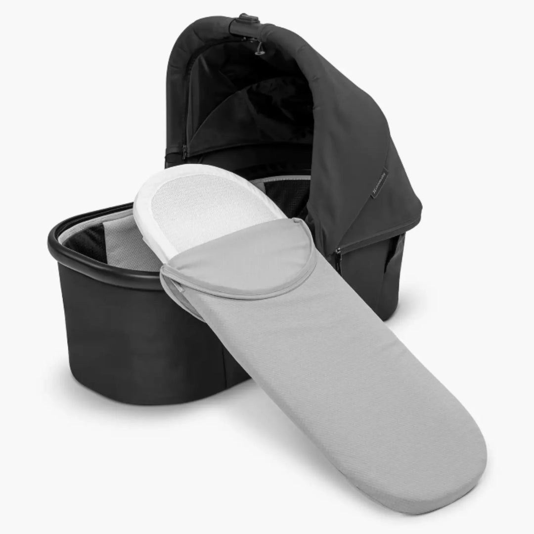UPPAbaby Carrycot V3 grey mattress cover shown with Jake carrycot, flap opened