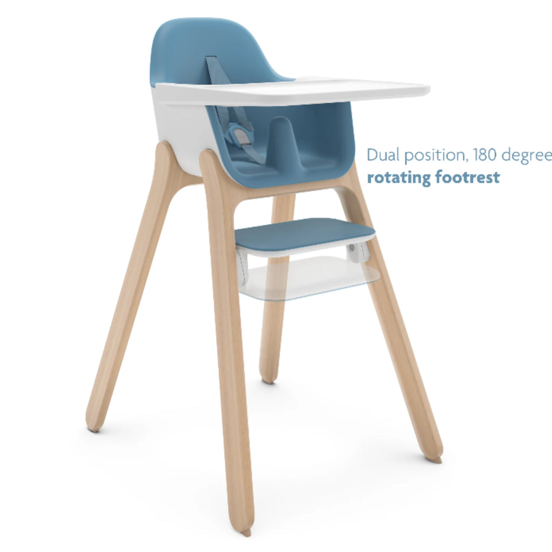 UPPAbaby Ciro High Chair Caleb in blue with dual-position 180-degree rotating footrest, modern wooden-leg baby high chair with adjustable tray and ergonomic seat design.