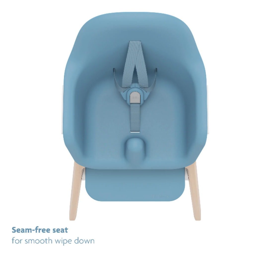 UPPAbaby Ciro High Chair Caleb in blue featuring a seamless, wipe-clean seat with 5-point harness and wooden legs; modern ergonomic baby high chair design.