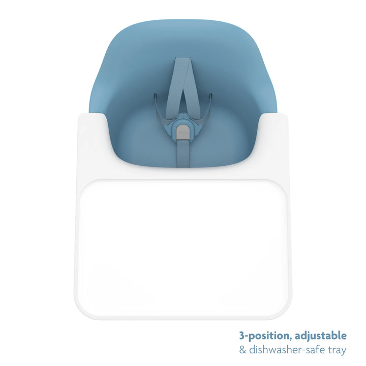 Blue high chair top down shot of three position, adjustable, dishwasher safe tray on a white background.