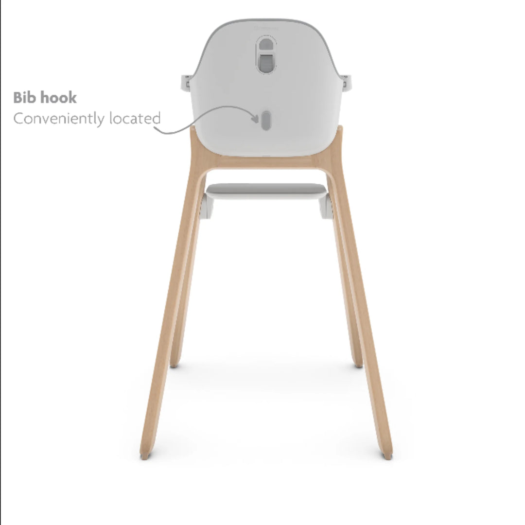UPPAbaby Ciro High Chair Chloe rear view showing convenient built-in bib hook, modern wooden-leg baby high chair with ergonomic design and smart storage feature.