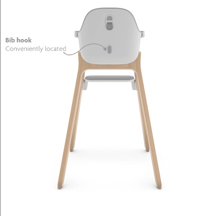 UPPAbaby Ciro High Chair Chloe rear view showing convenient built-in bib hook, modern wooden-leg baby high chair with ergonomic design and smart storage feature.