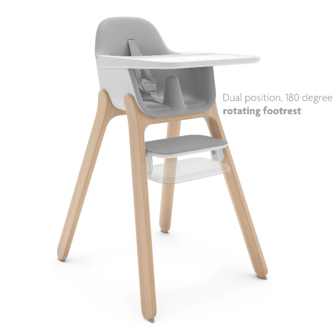 UPPAbaby Ciro High Chair Chloe in grey with natural wood legs, shown with dual-position 180-degree rotating footrest and removable tray—modern ergonomic baby high chair design.