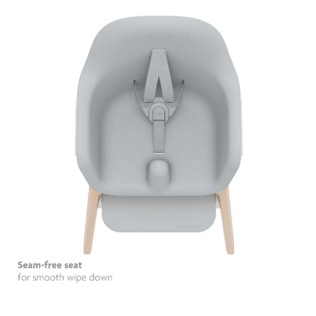 UPPAbaby Ciro High Chair Chloe with seamless wipe-clean seat, 5-point harness and modern minimalist design on natural wood legs, easy-clean baby high chair for feeding.
