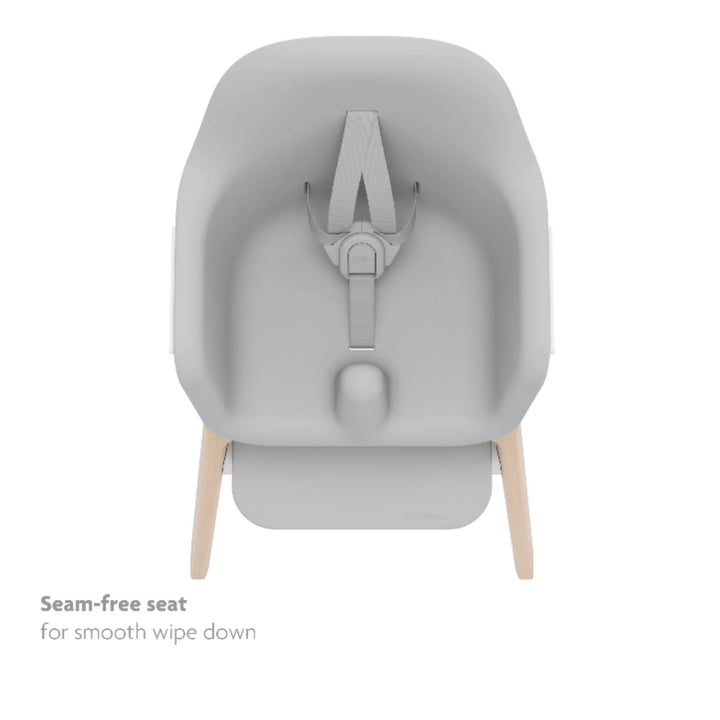 UPPAbaby Ciro High Chair Chloe with seamless wipe-clean seat, 5-point harness and modern minimalist design on natural wood legs, easy-clean baby high chair for feeding.