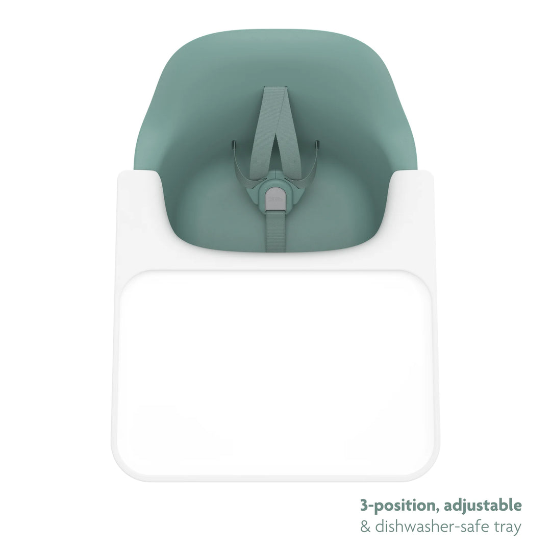 Green high chair top down shot of three position, adjustable, dishwasher safe tray on a white background.