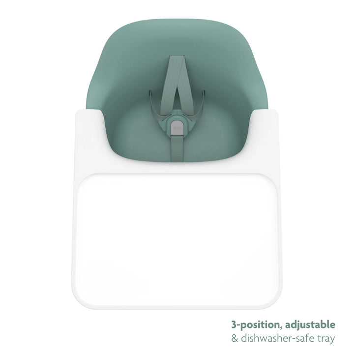Green high chair top down shot of three position, adjustable, dishwasher safe tray on a white background.