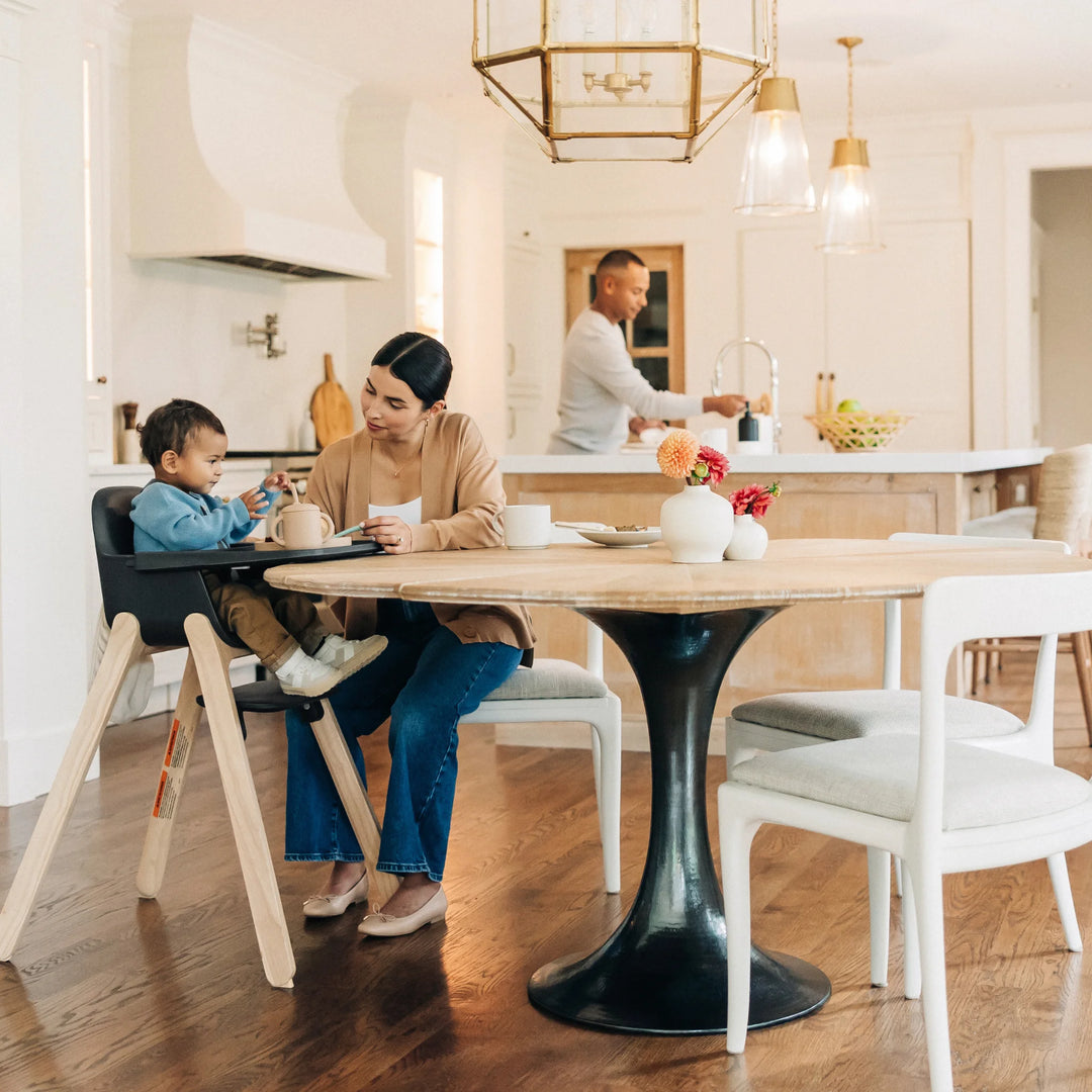 Woman with child at a dining table in a modern kitchen