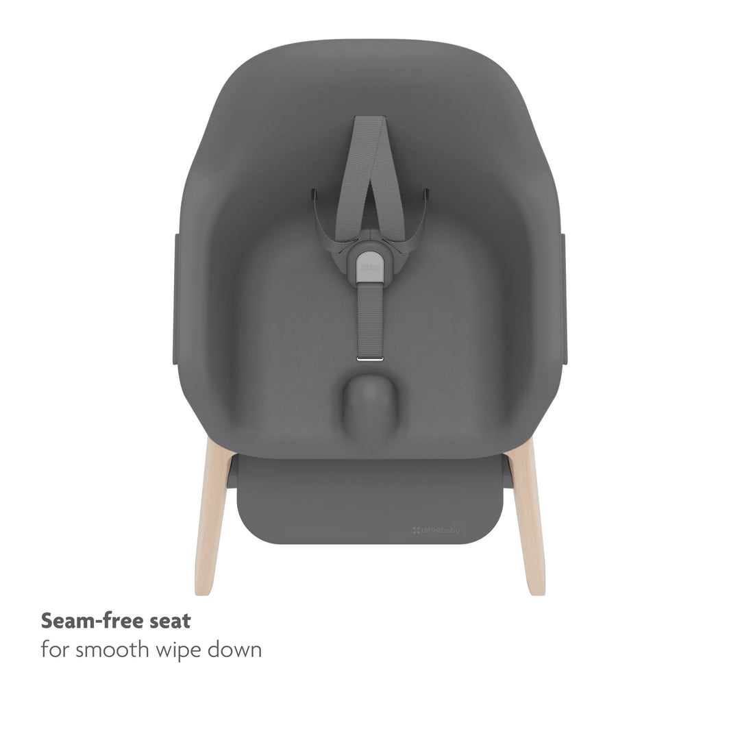 Black high chair top down view of seamless seat and no-rethread adjustable harness on white background.