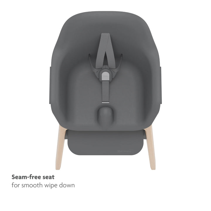 Black high chair top down view of seamless seat and no-rethread adjustable harness on white background.