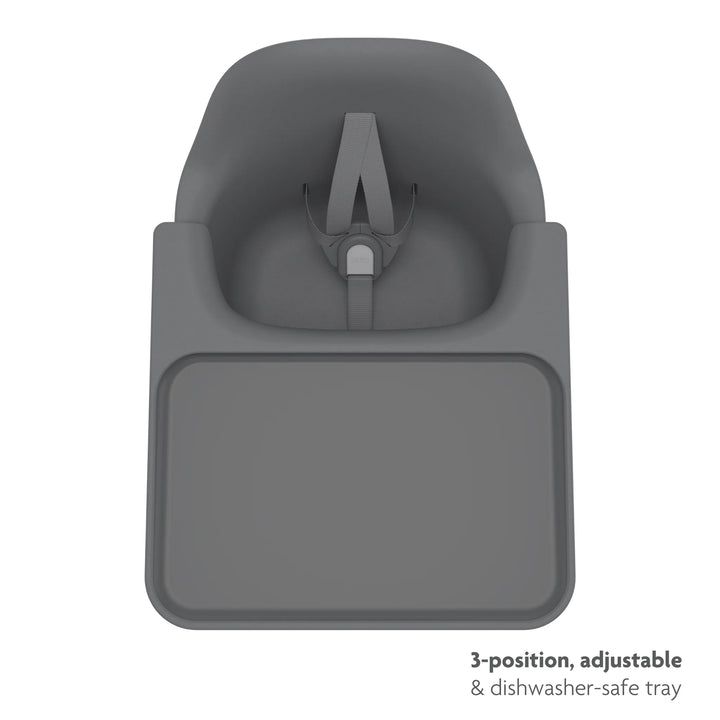 Black high chair top down shot of three position, adjustable, dishwasher safe tray on a white background.