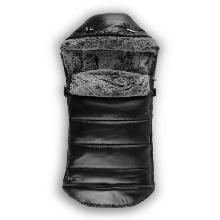 UPPAbaby Cozy Ganoosh Luxe footmuff in black with plush faux-fur lining, insulated and weather-resistant stroller footmuff designed to keep babies warm in winter.
