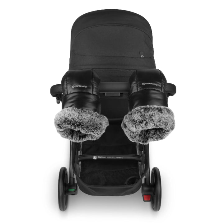 UPPAbaby Cozy Handmuffs Luxe attached to UPPAbaby Vista stroller, black luxury pram handmuffs with plush faux-fur lining for winter walks.