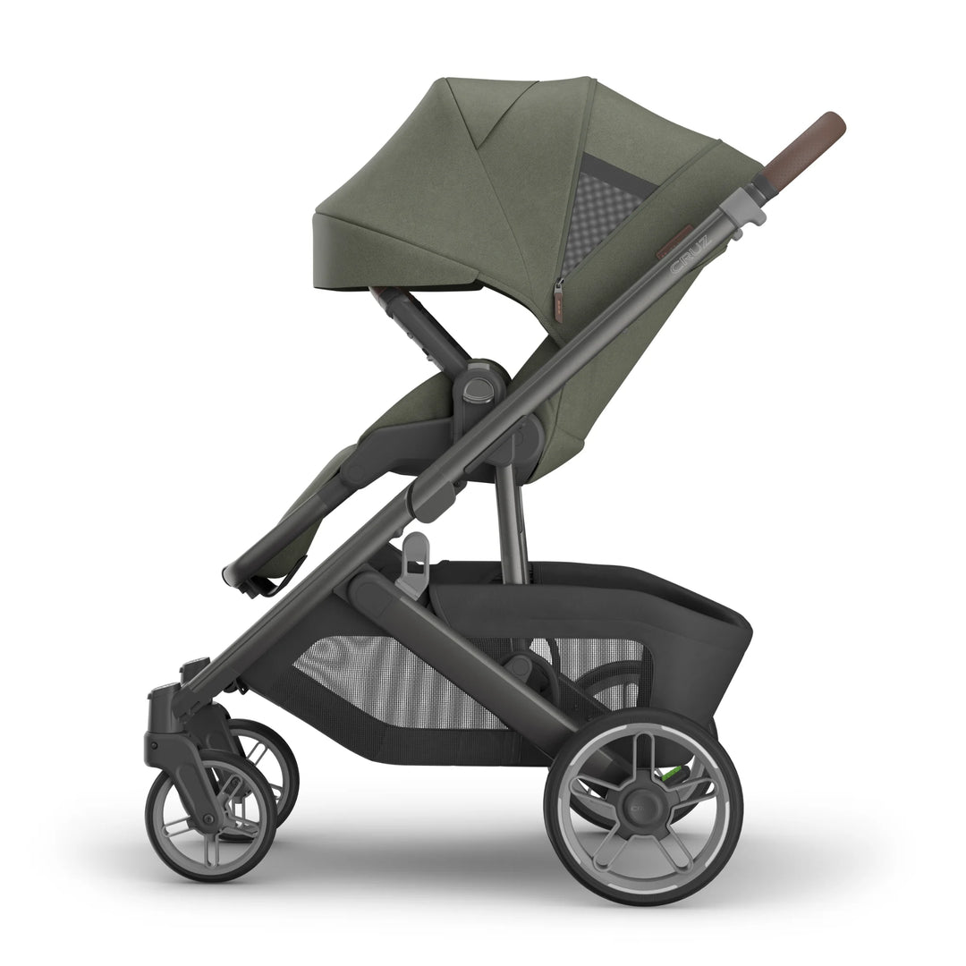 Green and black stroller on a white background with canopy extended.