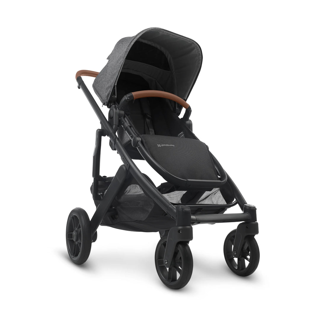 UPPAbaby Cruz V2 Greyson stroller front view – sleek charcoal grey pushchair with leather handlebar, spacious seat, and large undercarriage basket for everyday family use.