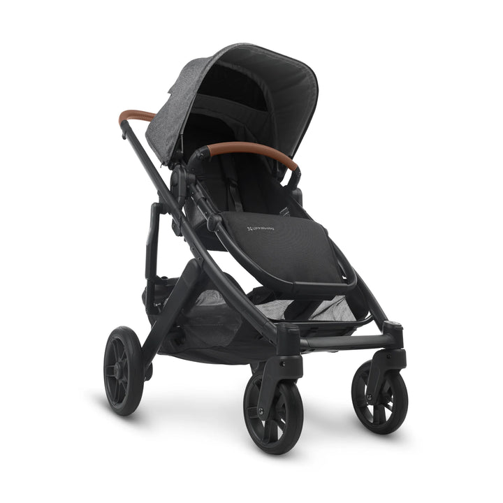 UPPAbaby Cruz V2 Greyson stroller front view – sleek charcoal grey pushchair with leather handlebar, spacious seat, and large undercarriage basket for everyday family use.