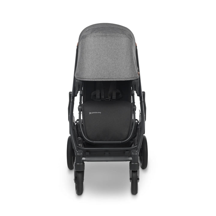 Front view of UPPAbaby Cruz V2 Greyson stroller – modern grey pushchair with extended canopy, padded toddler seat, and sturdy all-wheel design for everyday family use.