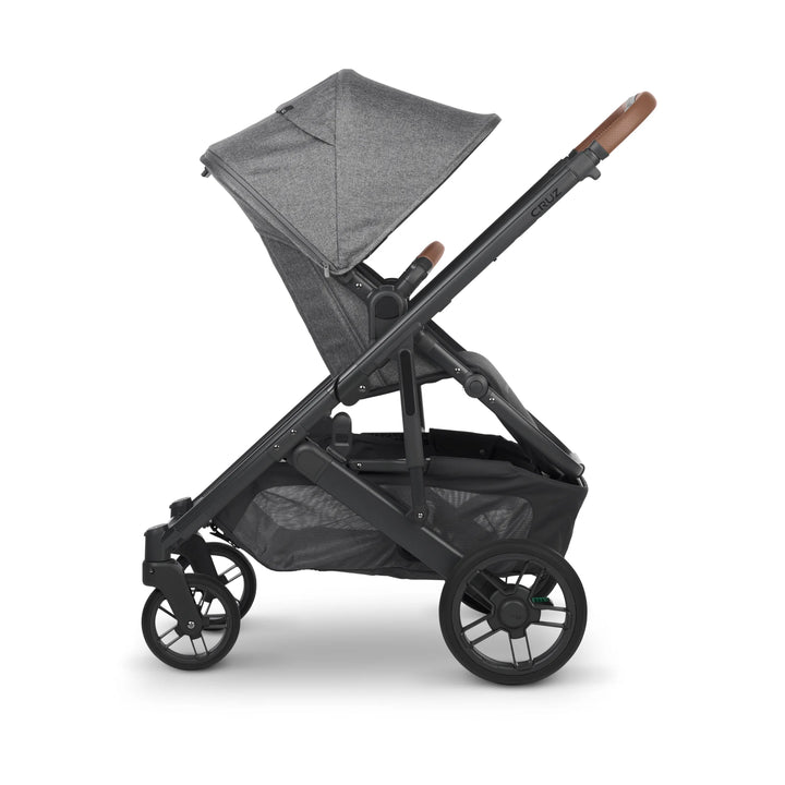 UPPAbaby Cruz V2 Greyson stroller side profile – sleek grey pushchair with leather handlebar, adjustable canopy, and large under-seat basket for everyday comfort and convenience.