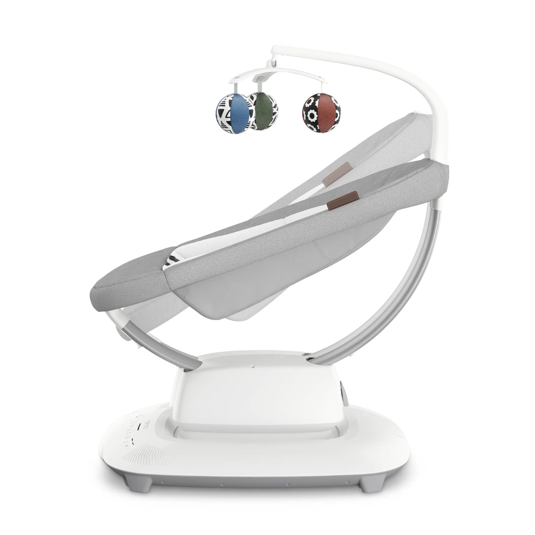 UPPAbaby MamaRoo smart swing Stella side view showing elevated seat height and reclined position with toy mobile.