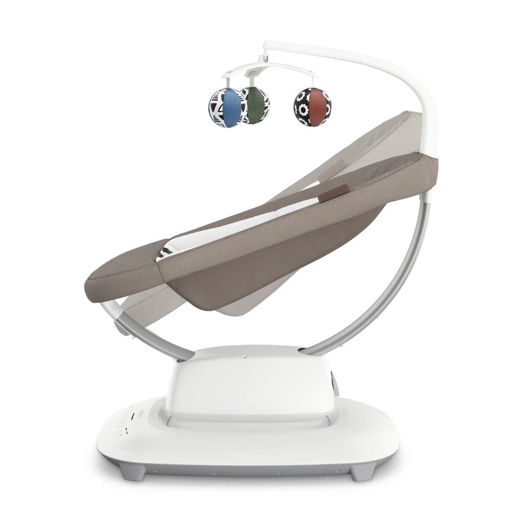 Side view of the UPPAbaby MamaRoo Smart Swing in Wells fabric with toy ball mobile on a white background.