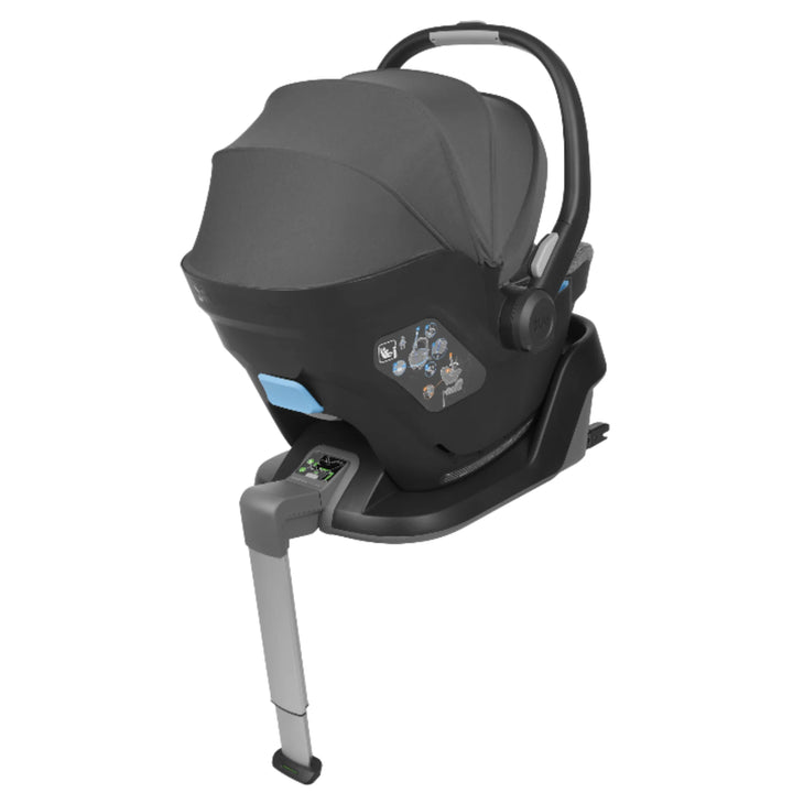 UPPAbaby MESA i-Size infant car seat in black attached to ISOFIX base with stability leg, rear-facing newborn travel system shown with canopy extended.