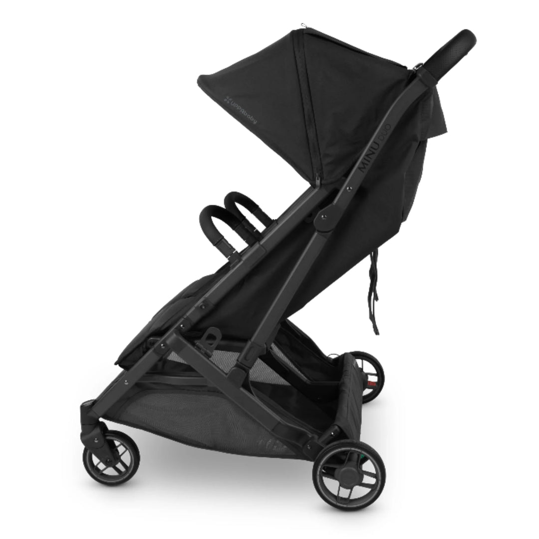 UPPAbaby MINU Duo double stroller side view in black with bumper bar and canopy on white background