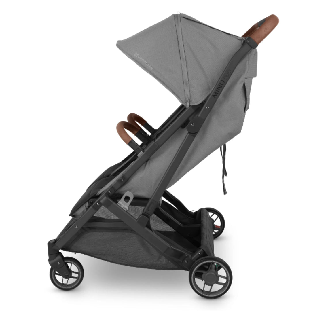 UPPAbaby MINU Duo double stroller side view in grey with leather handlebar on white background