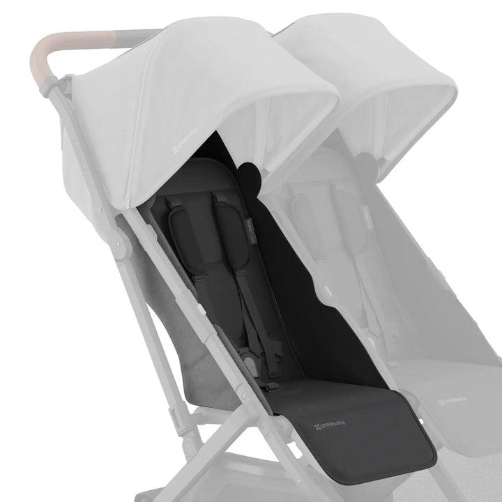 UPPAbaby Minu Duo stroller with grey (Greyson) replacement seat fabric installed on the left seat, with the opposite seat faded on a white background.
