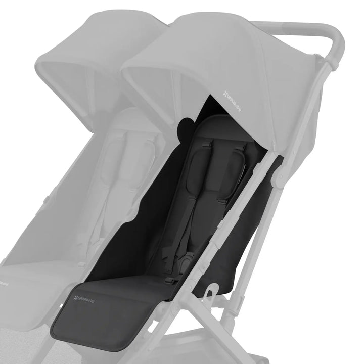 UPPAbaby Minu Duo stroller with black (Jake) replacement seat fabric installed on the right seat, with the opposite seat faded on a white background.