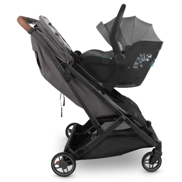 UPPAbaby MINU Duo stroller with MESA infant car seat attached using car seat adapters, side view on white background