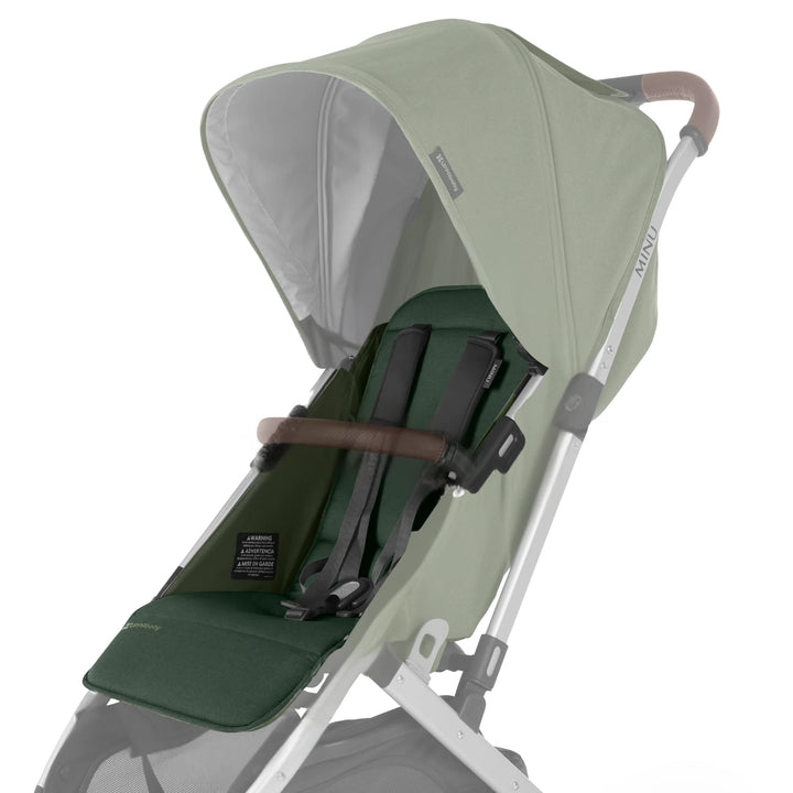 UPPAbaby Minu V2 replacement seat fabric in Emilia (green) attached to stroller frame on white background