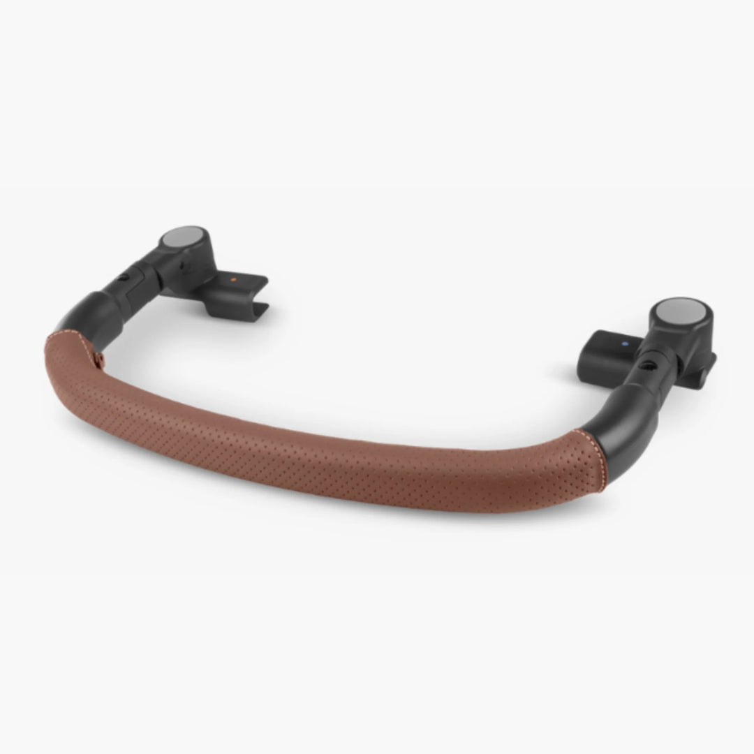 UPPAbaby MINU V3 bumper bar in Saddle with brown leather-look cover, on a white background.