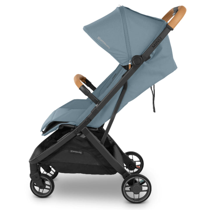 “Side view of the UPPAbaby MINU V3 stroller in light blue with Sand bumper bar and black frame, on a white background.”