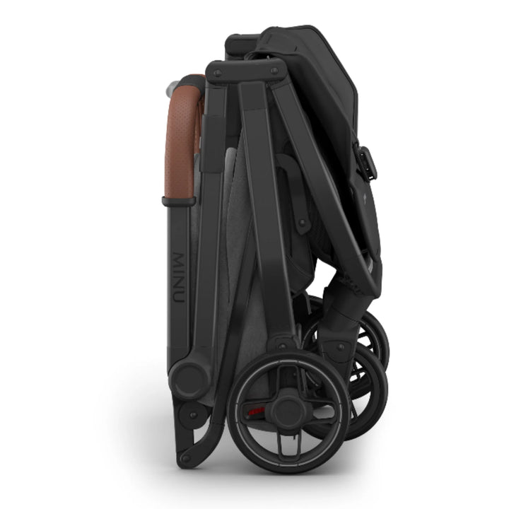 “Folded UPPAbaby MINU V3 stroller in Greysen on a white background.”