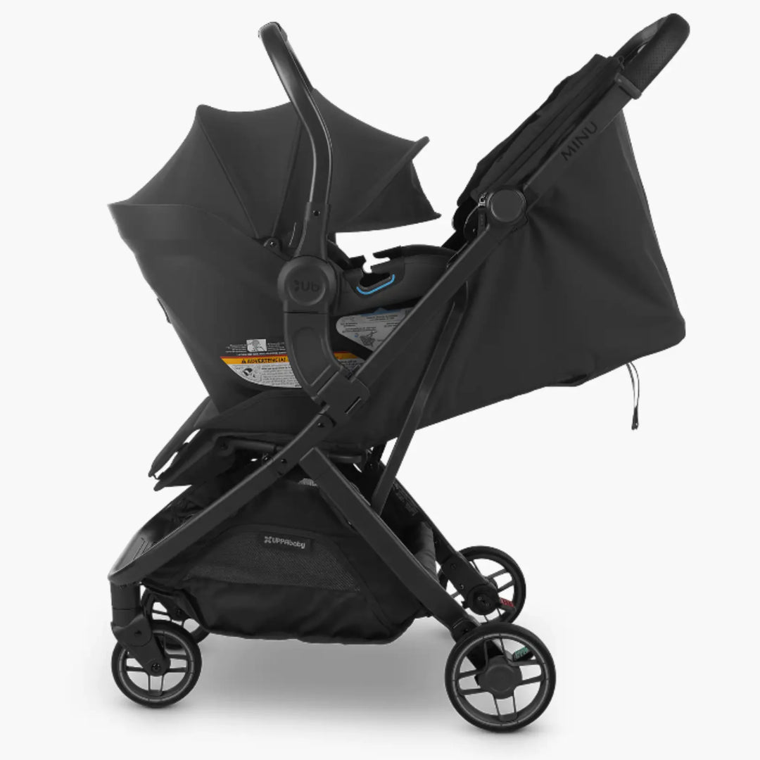 Side view of UPPAbaby Minu V3 stroller with Mesa i-Size infant car seat attached using Minu V3 car seat adapters